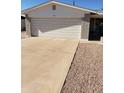 Attached garage with driveway at 908 S Ocotillo Dr, Apache Junction, AZ 85120