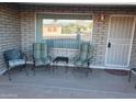 Covered porch with seating at 908 S Ocotillo Dr, Apache Junction, AZ 85120