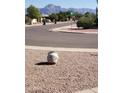 Quiet street view with mountain backdrop at 908 S Ocotillo Dr, Apache Junction, AZ 85120