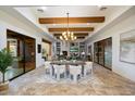 Elegant dining area with a large chandelier at 6523 E Lonesome Trl, Cave Creek, AZ 85331