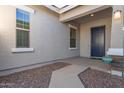 Home exterior showing a front porch and entryway at 21033 E Camina Buena Vis, Queen Creek, AZ 85142