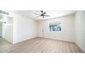 Bright and airy bedroom with hardwood floors and ceiling fan at 2834 E Nisbet Rd, Phoenix, AZ 85032