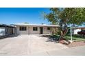 Single story home with a neat lawn and driveway at 2834 E Nisbet Rd, Phoenix, AZ 85032