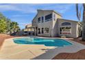 Inviting kidney-shaped pool with brick patio and spacious backyard at 5542 E Anderson Dr, Scottsdale, AZ 85254