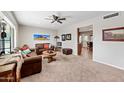 Spacious living room with leather couches and large artwork at 5254 E Cicero St, Mesa, AZ 85205