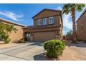 Two-story home with a two-car garage and desert landscaping at 13165 W Ventura St, Surprise, AZ 85379