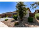 House exterior showcasing landscaping and driveway at 18767 W Canterbury Dr, Surprise, AZ 85388
