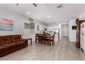 Open dining area with tile floors and kitchen view at 18767 W Canterbury Dr, Surprise, AZ 85388