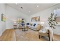 Open concept living room with light walls, comfortable seating, and large windows at 13789 E Geronimo Rd, Scottsdale, AZ 85259