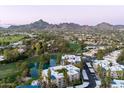 Aerial view of community near golf course and mountains at 5136 N 31St Pl # 648, Phoenix, AZ 85016