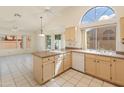 Bright kitchen with island and tile floors at 8737 W Kimberly Way, Peoria, AZ 85382