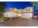 Two-story home with a large driveway and landscaped yard at 14674 W Pasadena Ave, Litchfield Park, AZ 85340