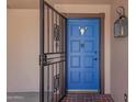 Blue front door with metal security screen at 7774 E Mariposa Dr, Scottsdale, AZ 85251