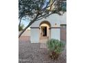 Front entryway with arched walkway, stone flooring, and landscaping at 2810 E Citrus Way, Chandler, AZ 85286