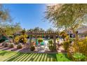 Community pool with pergola, grill, and putting green at 16013 S Desert Foothills Pkwy # 1150, Phoenix, AZ 85048