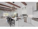 Modern kitchen with large island and white cabinets at 8536 E Preserve Way, Scottsdale, AZ 85266