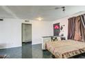 Dining area with a table and chairs, adjacent to a hallway at 3726 W Thomas Rd, Phoenix, AZ 85019