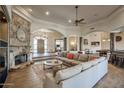 Open concept living area with a stone fireplace and comfortable seating at 11717 E Estrella Ave, Scottsdale, AZ 85259