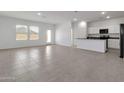 Spacious living area with tile flooring and kitchen island at 19373 W Coolidge St, Litchfield Park, AZ 85340