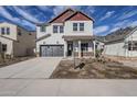 Two-story home with gray siding, red accents, and a landscaped front yard at 17978 W Long Lake Rd, Goodyear, AZ 85338