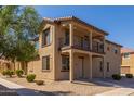 Two-story house with balcony and landscaped front yard at 913 E Agua Fria Ln, Avondale, AZ 85323