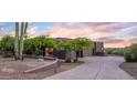 Exterior view of a Southwestern-style home at sunset at 6407 E Old Paint Trl, Carefree, AZ 85377