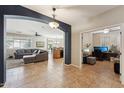 Open living room features a cozy fireplace and ample natural light at 14588 W Laurel Ln, Surprise, AZ 85379