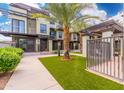 Modern condo building with lush landscaping and walkways at 7788 E Main St # 1002, Scottsdale, AZ 85251