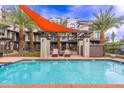 Enjoy the resort-style pool with a shade sail and comfortable seating at 7788 E Main St # 1002, Scottsdale, AZ 85251