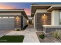 Modern home exterior with a walkway and brick facade at 9622 W Villa Chula Dr, Peoria, AZ 85383