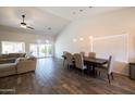Bright dining area with a large wooden table and six chairs, and access to the backyard at 2057 E Marquette Dr, Gilbert, AZ 85234