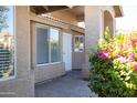 Front entrance with a covered walkway and brick pavers at 2057 E Marquette Dr, Gilbert, AZ 85234
