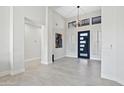 Bright and spacious entryway with high ceilings and modern light fixture at 12028 N 80Th Pl, Scottsdale, AZ 85260