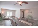 Bright dining room features wood floors and a rustic dining table at 5222 W Buckskin Trl, Phoenix, AZ 85083