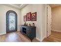 Elegant entryway with decorative console table and artwork at 726 E Citrus Hollow Way, Queen Creek, AZ 85140