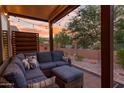 Covered patio with comfortable seating and string lights at 6939 S Red Hills Rd, Gold Canyon, AZ 85118