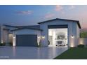 A stunning home exterior featuring a large RV garage and landscaping at 7575 W Gelding Dr, Peoria, AZ 85381