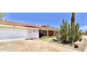 Ranch home with a large white garage door at 3614 W Krall St, Phoenix, AZ 85019