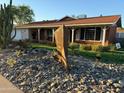 Mid-century modern home with unique yard art at 3614 W Krall St, Phoenix, AZ 85019