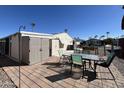 Backyard patio with table and chairs, and storage shed at 2400 E Baseline Ave # 301, Apache Junction, AZ 85119