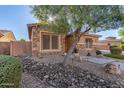 Craftsman style home with stone accents and desert landscaping at 2299 E Saddlebrook Rd, Gilbert, AZ 85298