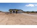 New single-story home with desert landscaping and two-car garage at 1587 S 391St Ave, Tonopah, AZ 85354