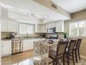 Modern kitchen with granite countertops, white cabinets, and a kitchen island at 14679 N Love Ct, Fountain Hills, AZ 85268