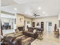 Spacious living room with a fireplace, pool table, and comfortable seating at 14679 N Love Ct, Fountain Hills, AZ 85268