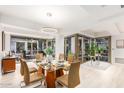 Modern dining room with glass table and balcony access at 7117 E Rancho Vista Dr # 2005, Scottsdale, AZ 85251