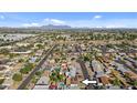 Wide shot showing the property's location in a residential neighborhood at 7428 E Carol Cir, Mesa, AZ 85208