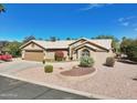 Single story home with two car garage and manicured landscaping at 15758 W Edgemont Ave, Goodyear, AZ 85395