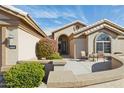 Front entry with courtyard and well-manicured landscaping at 15758 W Edgemont Ave, Goodyear, AZ 85395