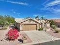 Single-story home with a two-car garage and desert landscaping at 15758 W Edgemont Ave, Goodyear, AZ 85395