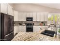 Kitchen with granite countertops and white cabinets at 1785 S Nebraska St, Chandler, AZ 85286
